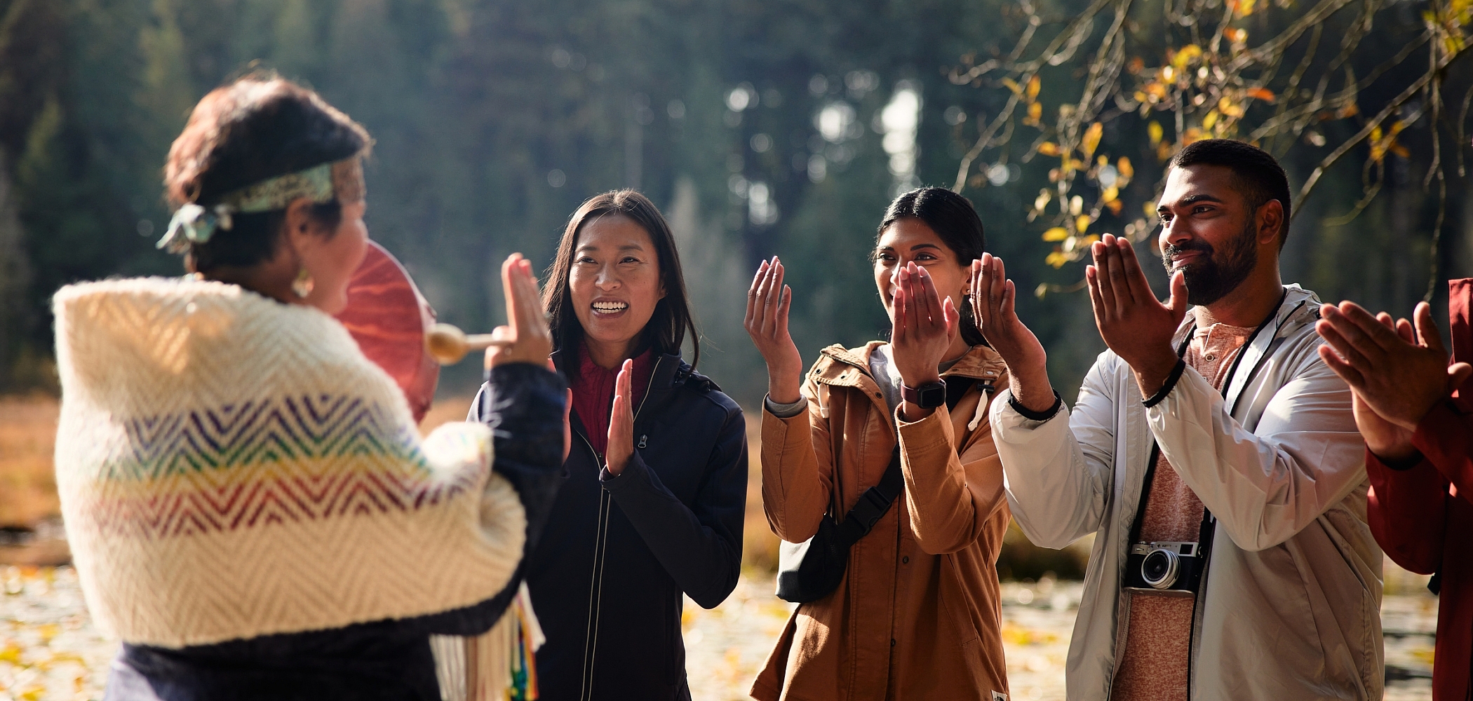 An Indigenous guide leads a walking tour through Stanley Park.