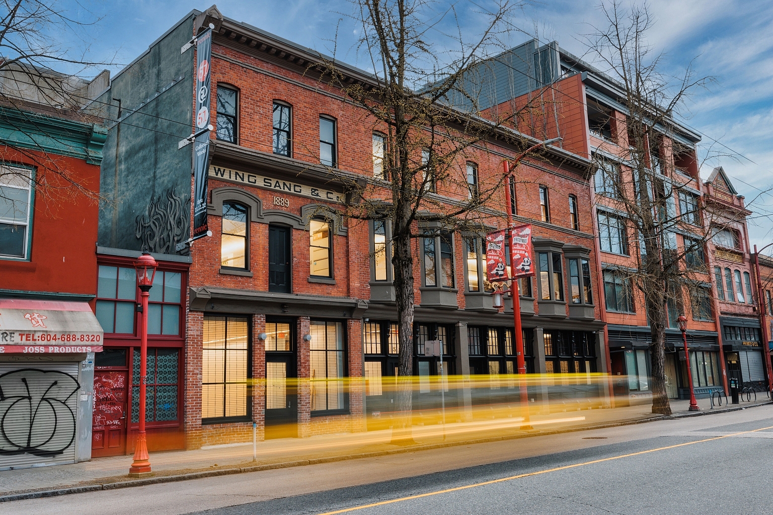 Exterior view of the Chinese Canadian Museum, bookended by other buildings, facing the street in Chinatown