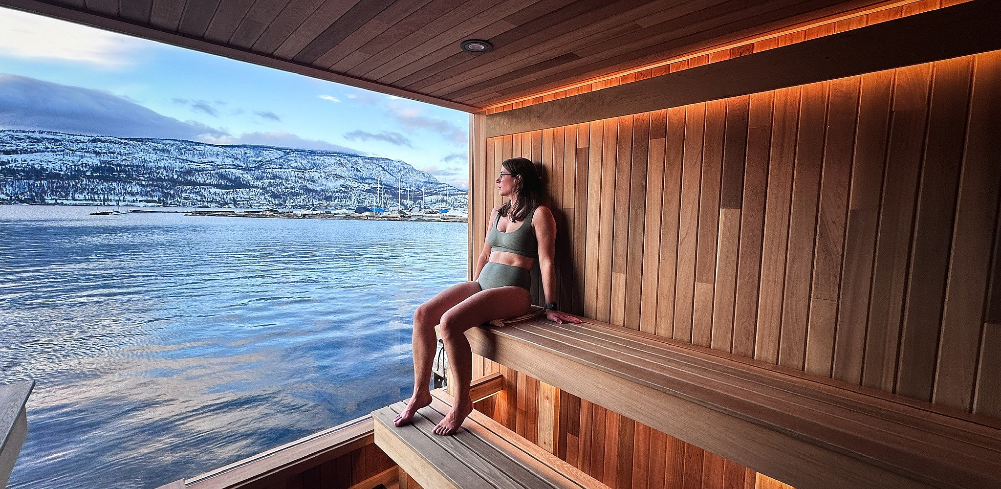 person inside a sauna room that is floating on water