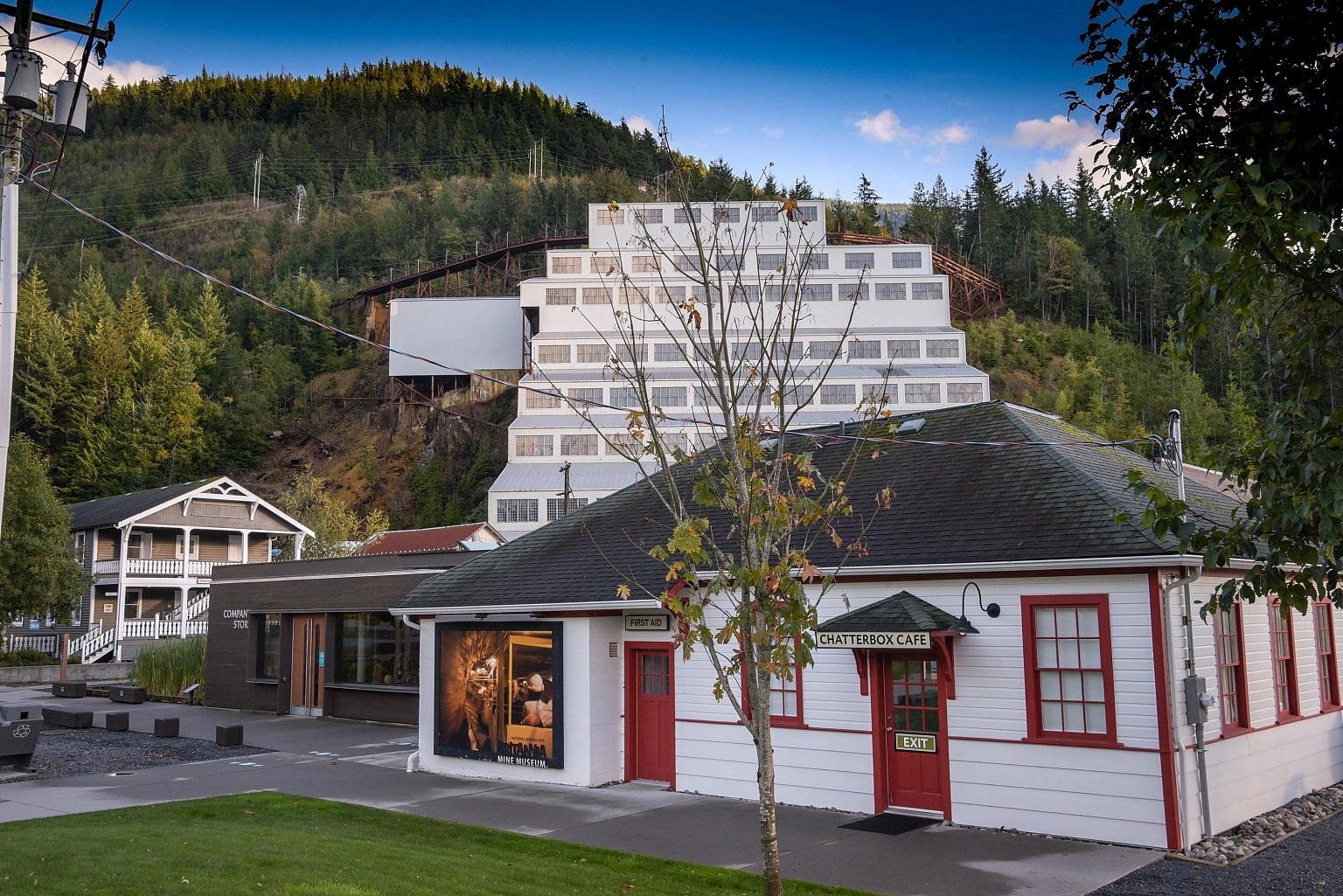 Chatterbox Cafe, a historic white building with white trim sits in front of Britannia Mine Museum.